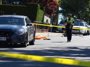 Toronto Police investigate the scene near Dufferin St. and Eglinton Ave. W. on Dyvenor Rd. after a man was stuck and killed by a van on June 22, 2016. (Dave Abel/Toronto Sun)