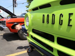 Mikhail Gallo-Edwards, 5, checks out a 1965 Dodge A100 pickup at a classic car show in Sudbury, Ont. on Saturday June 18, 2016. The event, which was hosted by Doyle Dodge and Southside Chevrolet Buick GMC, included a charity barbecue to support the KICX for Kids campaign, which in turn supports the NEO Kids Foundation at Health Sciences North. John Lappa/Sudbury Star/Postmedia Network
