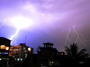 Lightning illuminates the night sky during a storm over Guwahati in this April 18, 2016 file photo. Lightning has killed as many as 93 people, mostly farm labourers working in fields, across eastern and northern India over the past two days. (BIJU BORO/AFP/Getty Images)