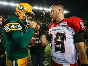 Calgary Stampeders quarterback Bo Levi Mitchell, right, and Edmonton Eskimos quarterback Mike Reilly are the top two quarterbacks in the CFL. (THE CANADIAN PRESS/Jeff McIntosh)