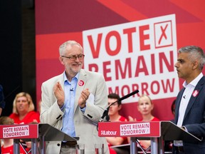 The leader of Britain's opposition Labour Party Jeremy Corbyn, left, applauds London Mayor Sadiq Khan as he makes an address during a European Referendum "Remain" rally in London, Wednesday, June 22, 2016. Britain votes whether to stay in the European Union in a referendum on Thursday. (AP Photo/Matt Dunham)