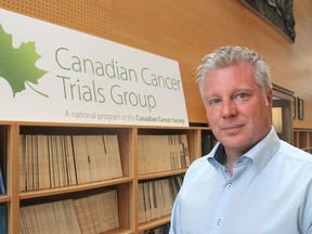 Dr. Chris O'Callaghan, at the Canadian Cancer Trials Group in Kingston on Tuesday, is a senior investigator in a new trial that produced effective results in improving the longevity and quality of life of patients with glioblastoma, an incurable brain cancer. (Michael Lea/The Whig-Standard)