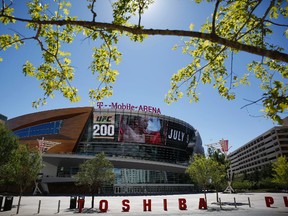 In this June 17, 2016 photo, an advertisement plays on a screen at the T-Mobile Arena in Las Vegas. (AP Photo/John Locher)