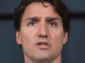 Prime Minister Justin Trudeau speaks with reporters as he takes part in a news conference to mark the end of the parliamentary session Wednesday June 22, 2016 in Ottawa. THE CANADIAN PRESS/Adrian Wyld