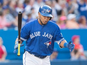 Toronto Blue Jays' Edwin Encarnacion reacts after hitting a home run against Arizona Diamondbacks' Robbie Ray during sixth-inning interleague action in Toronto on June 22, 2016. (THE CANADIAN PRESS/Fred Thornhill)