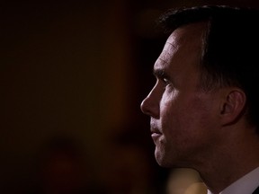 Federal Finance Minister Bill Morneau listens during a news conference after reaching a deal with his provincial and territorial counterparts to expand the Canada Pension Plan, in Vancouver, B.C., on Monday June 20, 2016. THE CANADIAN PRESS/Darryl Dyck