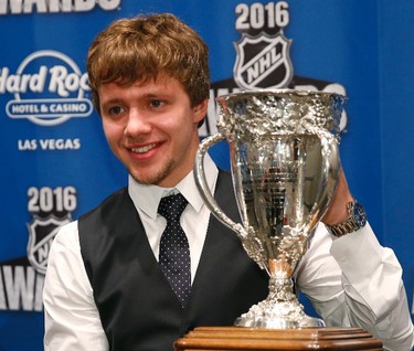 Chicago Blackhawks' Artemi Panarin, of Russia, holds the Calder Trophy after winning the award at the NHL Awards show, Wednesday, June 22, 2016, in Las Vegas. (AP Photo/John Locher)