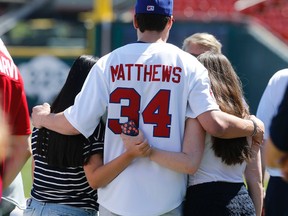 Auston Matthews, one of the six top prospects for this weekend's NHL draft had a chance to show some of his baseball skills at a  Buffalo Bisons game before their on June 22, 2016 while also taking time to pose with fans. (Michael Peake/Toronto Sun)