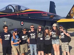Members of the Parkside Thunderstamps robotics team at the Great Lakes International Air Show on June 18. The team sold over three thousand dollars worth of programs over the weekend.
