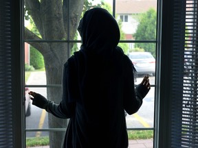 A Muslim mom said she was at a London grocery store with her four-month-old when she was attacked by a woman who spat at her, punched her and tried to pull off her hijab. She did not want to be identified. (Morris Lamont, The London Free Press)