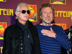 In this Oct. 9, 2012 file photo, Led Zeppelin guitarist Jimmy Page, left, and singer Robert Plant appear at a press conference ahead of the worldwide theatrical release of "Celebration Day," a concert film of their 2007 London O2 arena reunion show, in New York. Led Zeppelin's lawyers asked a judge Monday, June 20, 2016, to throw out a case accusing the band's songwriters of ripping off a riff for "Stairway to Heaven." (Photo by Evan Agostini/Invision/AP, File)