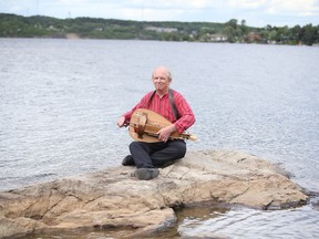 David Buley at the Living with Lakes Centre with his hurdy-gurdy in Sudbury, Ont. Buley is organizing an outdoor ‘sunrise’ concert at the Living with Lakes Centre on Canada Day. Gino Donato/Sudbury Star/Postmedia Network