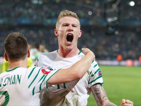 Ireland’s James McClean, right, and Seamus Coleman celebrate at the end of their Euro 2016 match against Italy at the Pierre Mauroy stadium in Villeneuve d’Ascq, near Lille, France, Wednesday, June 22, 2016. (AP Photo/Michel Spingler)