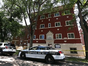 Winnipeg police investigate a homicide after emergency personnel were called to an apartment block in the 400 block of Furby Street during the early morning hours of Thu., June 23, 2016. An injured adult was transported from the scene but later died from what police called serious upper-body injuries. Kevin King/Winnipeg Sun/Postmedia Network