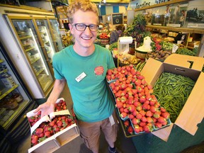 Colin Remillard is happy that growers have been pulling early crops, thanks to the weather. Colin co-owns St. Leon Gardens, in Winnipeg. (WINNIPEG SUN PHOTO)