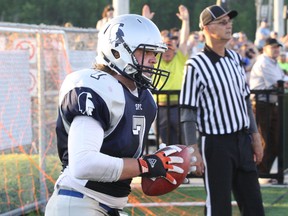 Sudbury Spartans receiver Logan while holds the ball after scoring a touchdown against the Oakville Longhorns on June 18. White, a native of Peterborough, Ont., moved to the Nickel City for work and signed up to play with the local Northern Football Conference entry. Ben Leeson/The Sudbury Star/Postmedia Network