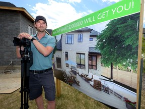 Carlton Leishman of Lemontree Photography shows a virtual staging in the unfinished backyard of the Dream Home Lottery grand prize home. (MORRIS LAMONT, The London Free Press)
