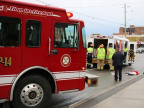 Paramedics treat a seriously injured man who was struck by a tractor trailer on Algonquin, near the Mountjoy Street intersection at around 8 p.m. Tuesday. The man remains in serious condition.