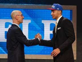 NBA Commissioner Adam Silver greets Ben Simmons after announcing him as the top pick by the Philadelphia 76ers during the NBA draft in New York on June 23, 2016. (AP Photo/Frank Franklin II)