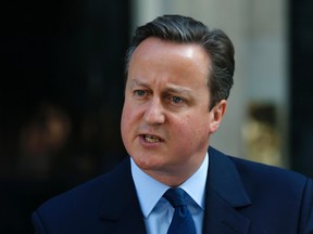 Britain's Prime Minister David Cameron speaks to the media in front of 10 Downing St., London, Friday, June, 24, 2016, as he announces he will resign by the time of the Conservative Party conference in the autumn, following the result of the EU referendum, in which the Britain voted to leave the EU. (AP Photo/Alastair Grant)