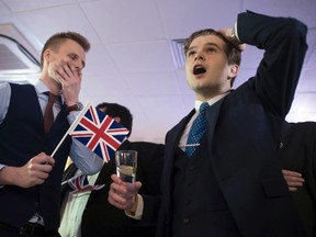 Supporters of leaving the EU celebrate at a party hosted by Leave EU in central London, on Friday, June 24, 2016, as they watch results come in from around the country after Thursday's EU referendum. (Stefan Rousseau/PA via AP, FIle)