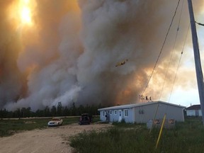 Approximately 2,000 people from the communities of Easterville and Chemawawin First Nation in Manitoba were evacuated on June 23, 2016, due to smoke and threat from a fire that had moved within a half-kilometre of the community. (BEVERLY GEORGE FACEBOOK PHOTO)