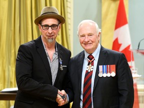 Sarnia's Mike Stevens, left, is congratulated by Gov.-Gen. David Johnston while being presented with the Meritorious Service Medal on Thursday, June 23, 2016, during a ceremony at Rideau Hall in Ottawa. The Governor General presented 17 Meritorious Service Crosses and 35 Meritorious Service Medals Thursday.
Credit: Sgt Ronald Duchesne, Rideau Hall, OSGG
Handout photo/The Observer/Postmedia