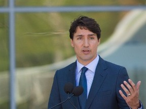 Prime Minister Justin Trudeau speaks to the crowd at the official unveiling of the Pierre Lassonde Pavillon at Musee national des beaux-arts du Quebec in Quebec City on Friday June 24, 2016. THE CANADIAN PRESS/Francis Vachon.