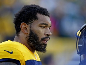 Green Bay Packers outside linebacker Julius Peppers warms up prior to the start of an NFL football game between the Green Bay Packers and San Diego Chargers in Green Bay, Wis. (AP Photo/Matt Ludtke, File)