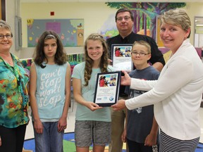Samantha Reed/The Intelligencer
Ontario Clean Water Agency presented a plaque Friday morning to students at Susanna Moodie Public School. Left to right is grade 7/8 teacher Melanie Clare, grade 7 student Hailey Phillips, grade 8 student Tessa Birt, grade 7 student A.J. Stewart and Cindy Spencer with the OCWA. Standing in the background is Perry DeCola, superintendent of treatment for the City of Belleville.