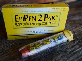 This Oct. 10, 2013, file photo, shows an EpiPen epinephrine auto-injector, a Mylan product, in Hendersonville, Texas.  (AP Photo/Mark Zaleski, File)