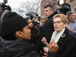 Premier Kathleen Wynne  talks with Janaya Khan, an organizer from Black Lives Matter. The group Black Lives Matter marched from police headquarters to Queens Park on Monday April 4, 2016. (CRAIG ROBERTSON, Toronto Sun)
