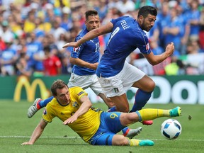 Italy's Graziano Pelle, right, is challenged by  Sweden's Kim Kallstrom during the Euro 2016 Group E soccer match between Italy and Sweden at the Stadium municipal in Toulouse, France, Friday, June 17, 2016. (AP Photo/Petr David Josek)