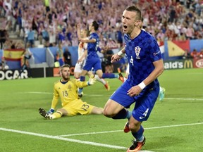Croatia's midfielder Ivan Perisic celebrates his goal during a Euro 2016 Group D match between Croatia and Spain at the Matmut Atlantique stadium in Bordeaux on June 21, 2016. (AFP PHOTO/GEORGES GOBET)