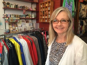 La Jolie Jupe boutique owner Cindy Kirshin deals with one of her final rush hours as her physical store is transforming into an online website next week. (Hala Ghonaim, The London Free Press)