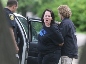 Police rescued two children, and took Sandra Geisbrecht (pictured yelling) into custody June 24, 2016. She fled police and was eventually contained in Bruce Park.
Chris Procaylo/Winnipeg Sun