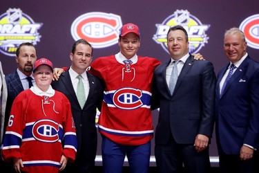 NINTH PICK: MIKHAIL SERGACHEV, MONTREAL CANADIENS
Mikhail Sergachev celebrates with the Montreal Canadiens after being selected ninth overall during round one of the 2016 NHL Draft on June 24, 2016 in Buffalo, New York. 
(Bruce Bennett/Getty Images/AFP)