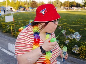 Luke Hendry/The Intelligencer
Allison Boyko of Belleville blows bubbles while walking in the Canadian Cancer Society’s Relay for Life Friday at Loyalist College. The society’s Brad Warner said 330 people participated in the 16th-annual fundraiser. Organizers were hoping to raise more than $100,000 in the 12-hour walk, with $70,000 counted by the start. See Monday’s Intelligencer for more coverage.