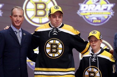 FOURTEENTH PICK: CHARLIE MCAVOY, BOSTON BRUINS
Charlie McAvoy celebrates with the Boston Bruins after being selected 14th overall during round one of the 2016 NHL Draft on June 24, 2016 in Buffalo, New York. 
(Bruce Bennett/Getty Images/AFP)