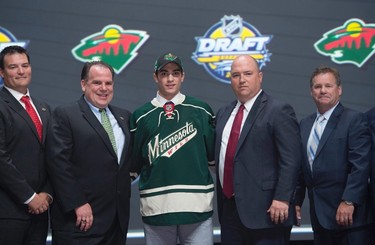 FIFTEENTH PICK: LUKE KUNIN, MINNESOTA WILD
Luke Kunin stands on stage with members of the Minnesota Wild management team at the NHL draft in Buffalo, N.Y. on Friday June 24, 2016. 
(THE CANADIAN PRESS/Nathan Denette)