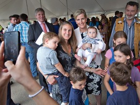 Sophie, Countess of Wessex, takes a photo with a family from Anzac near the Fort McMurray #468 First Nation during a visit to Fort McMurray Alta, on Friday June 24, 2016. THE CANADIAN PRESS/Jason Franson