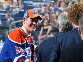 BUFFALO, NY - JUNE 24: 4. Jesse Puljujarvi celebrates after being selected fourth overall by the Edmonton Oilers during round one of the 2016 NHL Draft on June 24, 2016 in Buffalo, New York.   Bruce Bennett/Getty Images/AFP