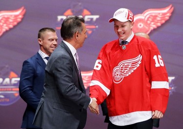 TWENTIETH PICK: DENNIS CHOLOWSKI, DETROIT RED WINGS Dennis Cholowski celebrates with the Detroit Red Wings after being selected 20th overall during the NHL Draft in Buffalo on June 24, 2016. (Bruce Bennett/Getty Images)