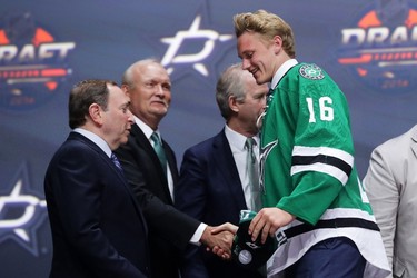 TWENTY FIFTH PICK: RILEY TUFTE, DALLAS STARS Riley Tufte celebrates with the Dallas Stars after being selected 25th during the NHL Draft in Buffalo on June 24, 2016. (Bruce Bennett/Getty Images)