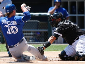 Chicago White Sox catcher Dioner Navarro, right, tags out Toronto Blue Jays’ Josh Donaldson at home in Chicago Saturday, June 25, 2016. (AP Photo/Nam Y. Huh)
