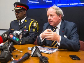 Toronto Police Chief Mark Saunders (left) and Toronto Police Services Board Chair Andy Pringle address media on the Interim Report of the Future of Policing at at Police Headquarters in Toronto  on Thursday, June 16, 2016. Ernest Doroszuk/Toronto Sun/Postmedia Network