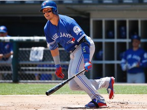 Blue Jays' Troy Tuolowitzki watches after hitting an one-run double against the Chicago White Sox during the first inning on Saturday in Chicago. (AP/PHOTO)