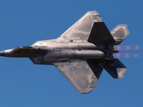 An F-22 Raptor fires its afterburners during a fast-paced demonstration flight Saturday afternoon at the Quinte International Air Show.