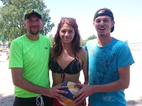 From left: Mike Wiens, Melissa Gaumond and Devon Wiggins get ready to play volleyball as part of a charity tournament at Britannia Beach on Saturday. Aidan Cox/Postmedia