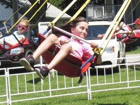 Olivia Lessard, 8, flies during Saturday's Canada Day celebration in Bright’s Grove. Story and photo on A3.Photo taken near Sarnia, Ontario on Saturday, June 25, 2016.NEIL BOWEN/SARNIA OBSERVER/POSTMEDIA NETWORK